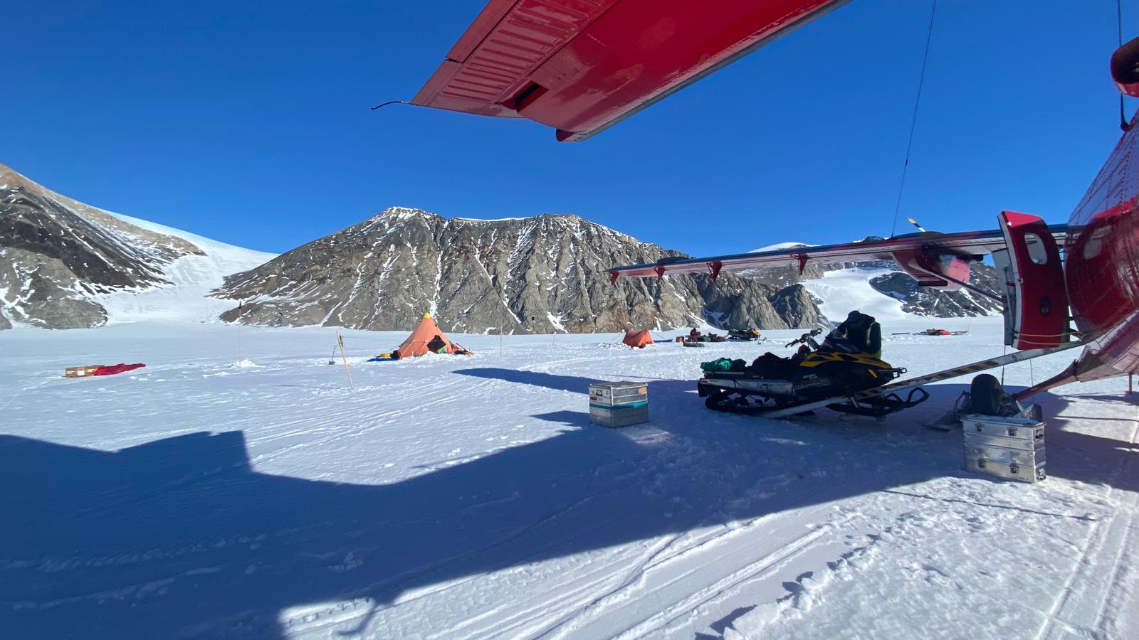 Camp from under the twin otter wing, looking towards the true right margin of the tributary